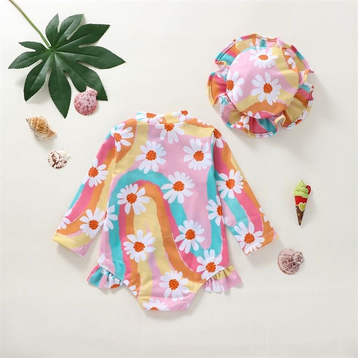 Get your little one ready for a day filled with splashes, giggles and unforgettable memories in this super cute and colorful floral swimsuit that will keep her protected and ready for a fun day at the pool or beach. Upf 50+ Swimwear For Beach Season Playtime, Summer Swimwear With Upf 50+ For Playtime, Upf 50+ Swimwear For Summer Playtime, Upf 50+ Swimwear For Summer, Cute Swimwear With Uv Protection For Vacation, Cute Printed Swimwear For Beach Season, Summer Swimwear With Upf 50+ For Playwear, Uv Protection Swimwear For Spring Playwear, Cute Printed Swimwear For Poolside