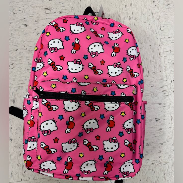 Hello Kitty Backpack Medium Size Pink Perfect For School Pink Hello Kitty Print Casual Backpack, Casual Pink Hello Kitty Backpack, Pink Hello Kitty Backpack For End Of School Year, Casual Pink Hello Kitty Print Backpack, Trendy Pink Backpack With Cat Design, Trendy School Backpack With Cat Design, End Of School Year Pink Hello Kitty Backpack, End Of School Year Hello Kitty Pink Backpack, Pink Hello Kitty Backpack For Back To School