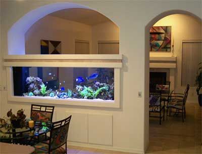 an aquarium in the middle of a dining room