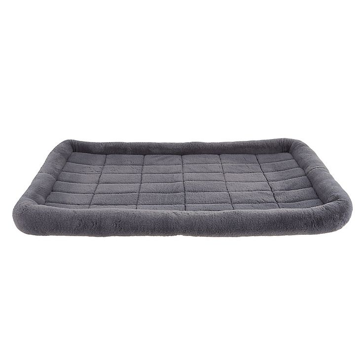 a dog bed that is made out of grey fabric and has a long, rectangular shape