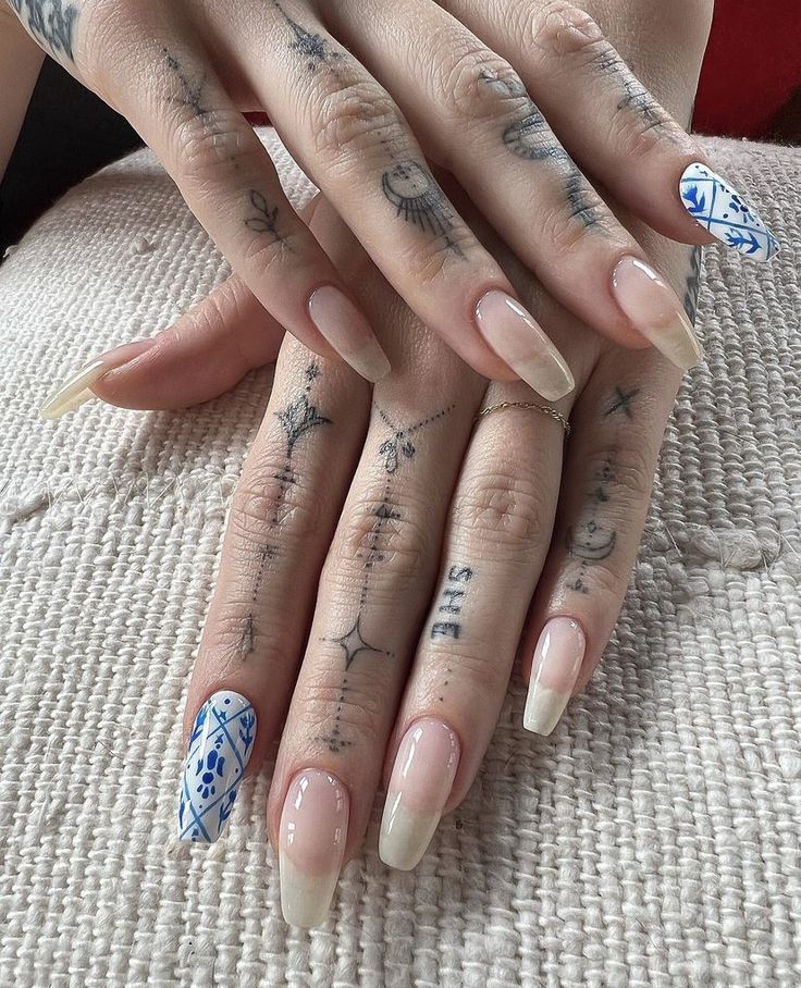 a woman's hands with tattoos on them