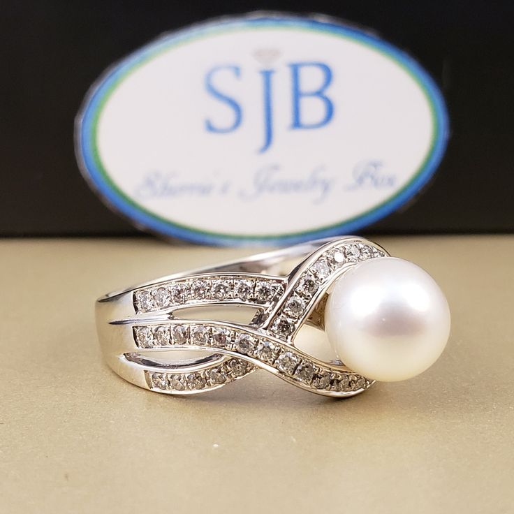 "Pearl & Diamond Ring Featuring a Genuine White Saltwater Pearl measuring approximately 7.8mm. Set in a 14k White Gold Braided band Full of Genuine sparkling white Diamonds, beautiful to complement a wedding dress. The Diamond total weight equals approximately .50 carats. A unique, bright white gold diamond statement ring, for any occasion. **Ring size: 6.5 **Pearls are the official June Birthstone. **Diamonds are an official April Birthstone. **This item can be sized up 2 sizes for an addit Classic Diamond Rings Aaa Quality, Fine Jewelry Pearl Ring With Round Band For Anniversary, Fine Jewelry Round Cut Pearl Ring For Anniversary, Elegant 14k White Gold White Ring, Anniversary Pearl Ring With Round Band, Formal Diamond Pearl Ring With Round Band, Fine Jewelry Pearl Ring For Anniversary, Formal White Gold Diamond Ring Aaa Quality, Aaa Quality Diamond Classic Rings