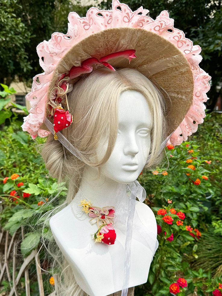 Elevate your ensemble with this exquisitely designed hat, where elegance meets whimsy. The brim is adorned with intricate lace cutouts, delicate ruffles, and a charming bead trim that encircles the edge, offering a touch of vintage sophistication. The crown of the hat features enchanting embellishments, including floral accents, playful bows, and additional ruffle detailing, creating a harmonious blend of textures and shapes. Adding a sweet touch, the hat comes with a delightful strawberry charm Adjustable Short Brim Headpiece For Garden Party, Whimsical Costume Hats And Headpieces For Spring, Whimsical Adjustable Hat For Garden Party, Whimsical Headpiece For Garden Party, Whimsical Brimmed Costume Hats For Garden Party, Whimsical Brimmed Adjustable Fascinator, Whimsical Adjustable Headpiece For Garden Party, Whimsical Adjustable Headpieces For Garden Party, Whimsical Brimmed Hat For Garden Party