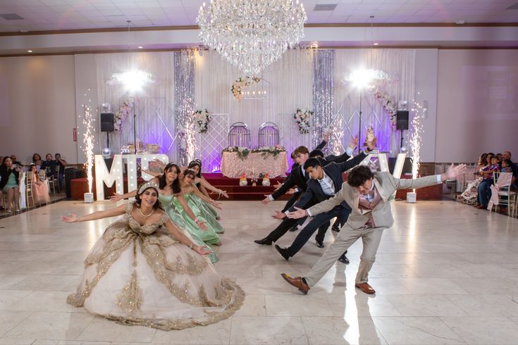 a group of people that are standing in the middle of a dance floor