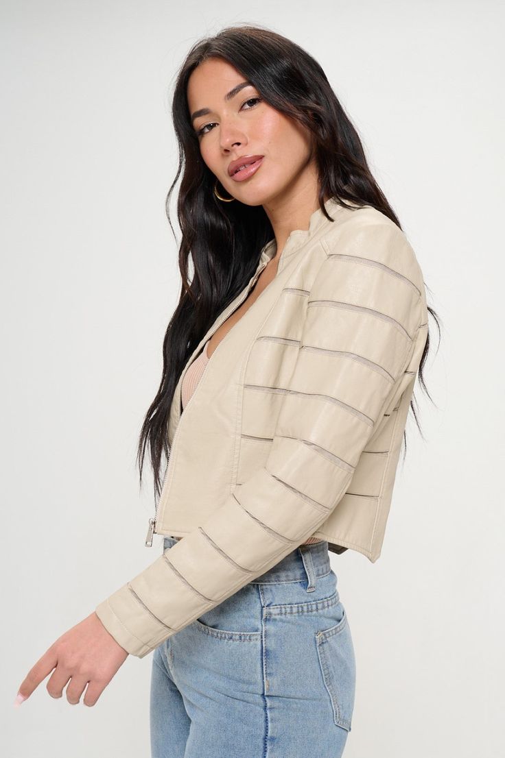 Elevate your casual ensemble with our Savannah Breeze Moto Jacket. Crafted from a luxuriously soft faux leather, this jacket features a subtle stand collar and a sleek zippered front for an effortlessly chic silhouette. The distinctive horizontal paneling on the sleeves adds a touch of edgy sophistication, while the neutral beige hue makes it a versatile staple for any wardrobe. Perfect for transitioning through seasons, it’s designed to add a layer of warmth without sacrificing style. Whether p Sheer Jacket, Casual Beach Wear, Neutral Beige, New Arrival Dress, Shop Swimwear, Moto Jacket, Favorite Jeans, Bottoms Pants, Savannah Chat