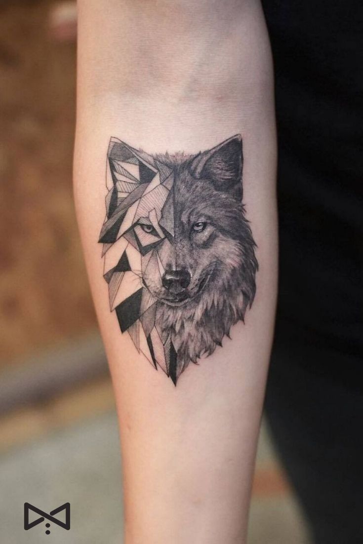 a black and white tattoo with a wolf head on the left arm, in geometric shapes