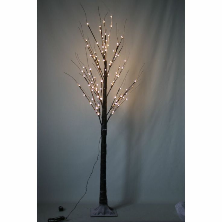 a lighted tree with white lights on it