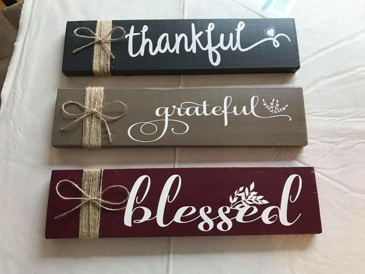 three wooden signs with the words grateful, grateful and beseld tied to them