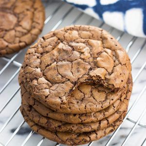 a stack of cookies sitting on top of a cooling rack