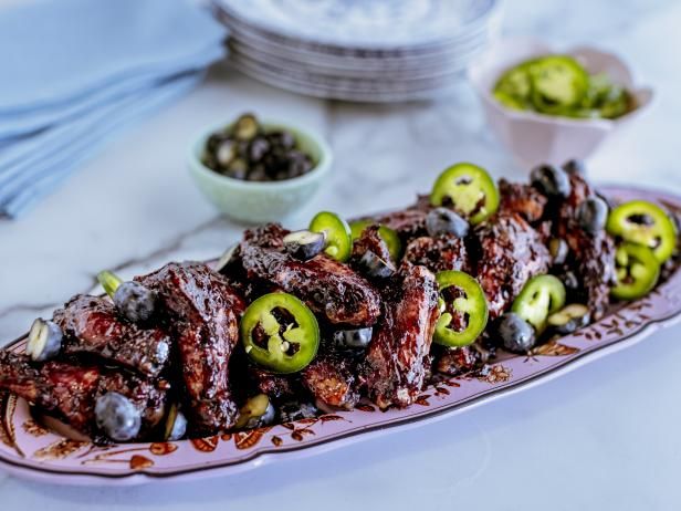 the food is prepared and ready to be eaten on the table with other dishes in the background