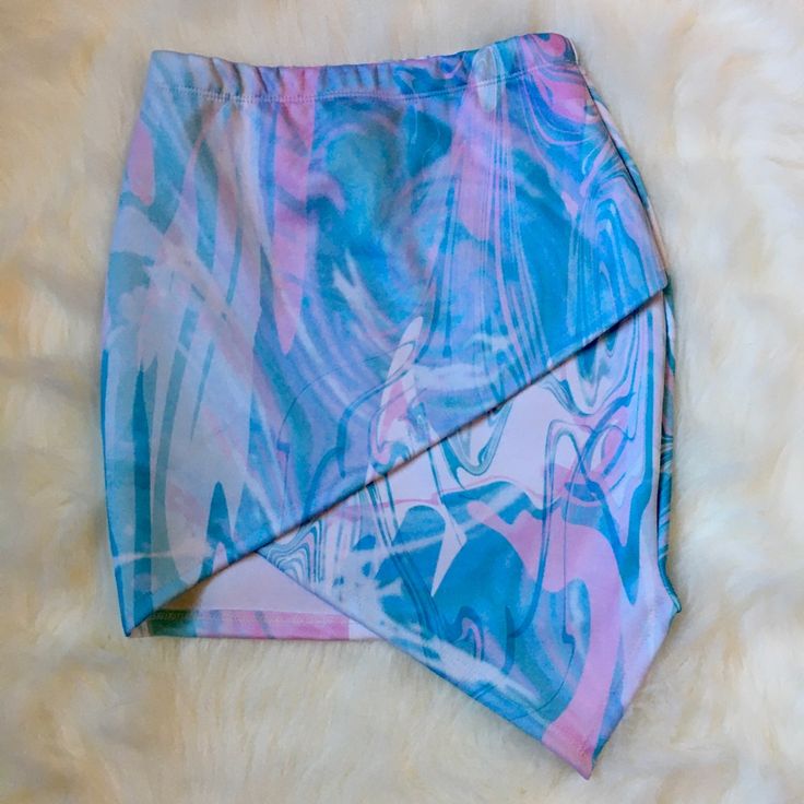 Nwot, Never Worn Mini Skirt Elastic Waist Band, Asymmetric Multi-Colored Swirled Print, Eye Catching In Person! Pair It With A White Bodysuit For A Night Out Open To Offers! Irregular Spring Party Bottoms, Asymmetrical Skirt Bottoms For Party In Multicolor, Trendy Irregular Skirt For Spring, Pink Party Bottoms With Asymmetrical Hem, Trendy Asymmetrical Skort For Spring, Asymmetrical Blue Skirt For Summer, Fitted Asymmetrical Skort For Spring, Asymmetrical Mini Skirt With Lining For Spring, Pink Bottoms With Asymmetrical Hem For Spring