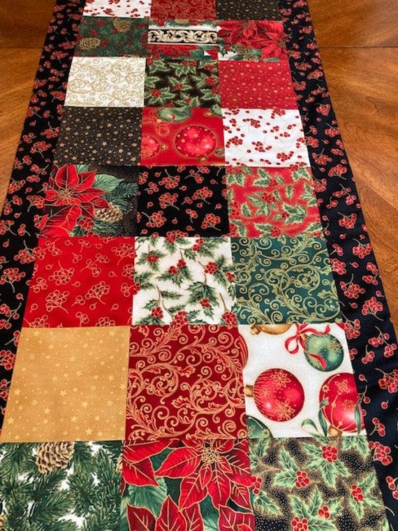 a table runner made out of christmas fabric