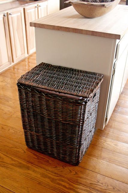 a basket sitting on top of a wooden floor