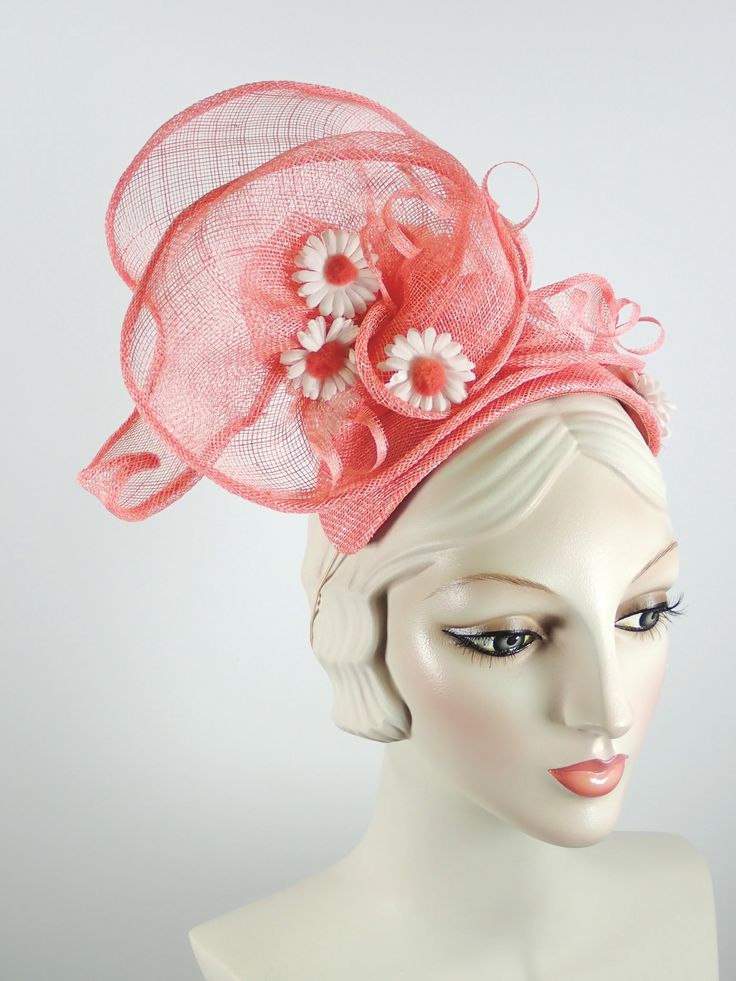 This women's peach/coral fascinator hat is a sure bet for Kentucky Derby or Kentucky Oaks. Or any summer event really, like church, ladies tea, or just for fun. It is made with sinamay straw and is very light and airy. The hand sculpted sinamay sits atop a handmade bandeau base and is secured with an elastic band that goes behind the ears and head to keep the hat in place. It is topped with vintage daisies and hand rolled sinamay leaves as well as sinamay swirls for added texture. An inner grosg Spring Adjustable Sinamay Fascinator, Fitted Summer Headpiece For Church, Pink Sinamay Fascinator For Church, Summer Sinamay Fascinator For Races, Spring Beach Fascinator, Fitted, Orange Straw Hat With Curved Brim For Spring, Orange Curved Brim Straw Hat For Spring, Spring Orange Straw Hat With Curved Brim, Spring Beach Fascinator