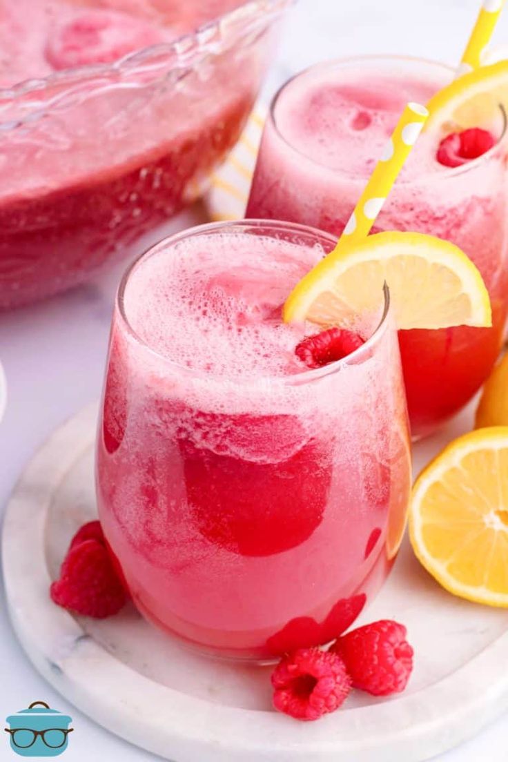 two glasses filled with raspberry lemonade punch