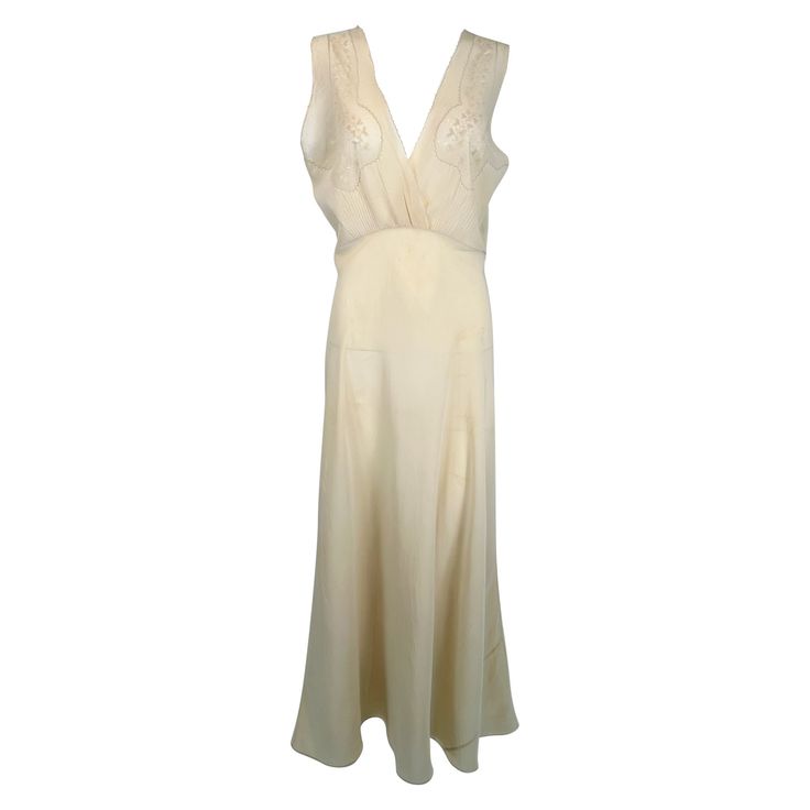 1930s cream bias cut sheer silk hand embroidered & appliqued slip dress gown. Beautiful sheer silk gown in pale cream. The cross over bodice has inset sheer silk panels at the bust, each with delicate applique & embroidery. The gown has a high waist, the bias skirt is fitted through the hips & flairs at the hem. Fits like a size medium. In excellent wearable condition. All our clothing is dry cleaned and inspected for condition and is ready to wear. Any condition issues will be noted. For visual Bias Skirt, Lace Tunic Dress, Color Crema, Maxi Gown Dress, Costume Institute, Silk Gown, Dress Gown, Silk Chiffon, The Cross