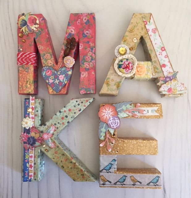 the letters are made out of paper and decorated with flowers