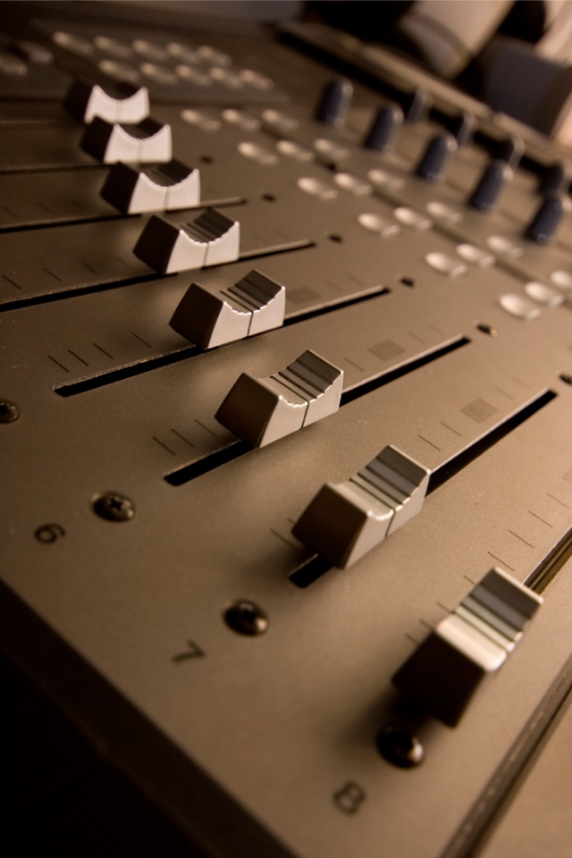 an electronic mixing console with buttons and knobs