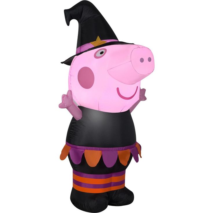 a large inflatable pig with a witches hat on it's head and legs