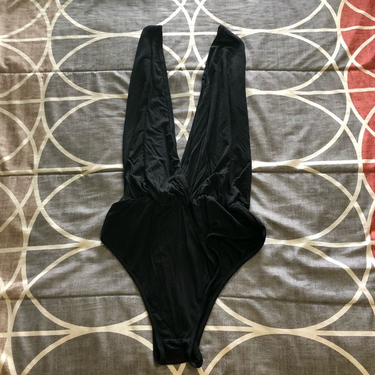 Very Sexy, Slip On Bodysuit With Plunging Neckline. Size Is Xl, Fits Large. Nwt. Black V-neck Bodysuit For Beachwear, Chic Black High Cut Bodysuit, Chic Black High-cut Bodysuit, Solid Color Beachwear Bodysuit For Parties, Stretch Low-cut Bodysuit For Beach, Low-cut Lined Bodysuit For Swimming, Night Out Triangle Top Bodysuit With Lined Body, Night Out Bodysuit With Triangle Top, Triangle Top Bodysuit For Night Out