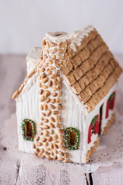 a gingerbread house is on a doily