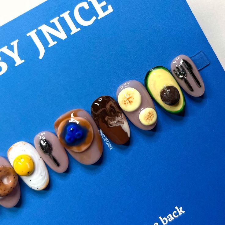 The Breakfast Club 🥞🥯🫐🍌🍴An assortment of delicious breakfast options loaded with carbs! I hand sculpted each food and I so wish they were edible this set is good enough to eat. Hand made and 3D sculpted nail art @nailz_by_dev @nailzbydevshop trippy gel, complexion collection, 9mm, slim shady brush @nailreserve_la various gel paints @madam_glam various gel paints and polishes @ballpit_addict @ballpit_shop Double trouble liner @by.chloenails My FAVORITE glossy top coat #3dnailartdesign ... Breakfast Nail Art, Food Inspired Nails, Pancake Nails, Brunch Nails, Nail Doodles, Sushi Nails, Breakfast Nails, Dessert Nails, Painted Acrylic Nails