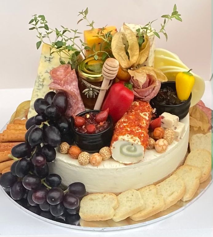 a cake covered in lots of different types of food