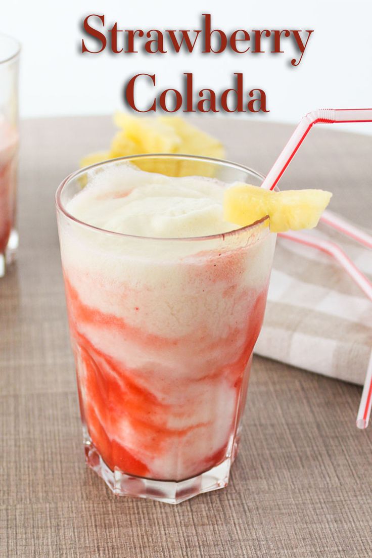 two glasses filled with ice cream and strawberries next to each other on a table