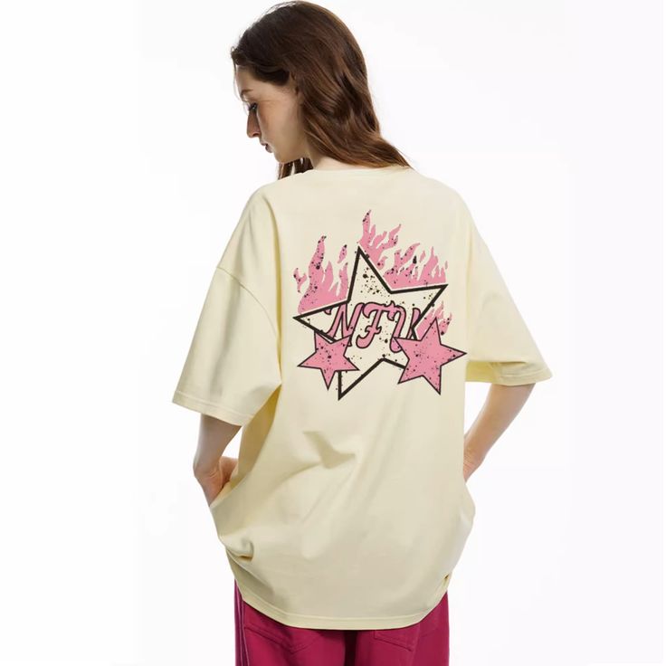 🔥🔥BUY 2 GET 20% OFF | AUTO DISCOUNT ON CHECKOUT🔥🔥 Add a pop of style to your wardrobe with this High Street Pink Star Flame T-Shirt. The t-shirt features a fun, vibrant design with a colorful flame pattern and a stylish star embellishment. Crafted from durable cotton for long-lasting comfort. Features: -100% Cotton -Crew Neckline -Flame Star Graphic -Regular fit -High Street style Pop Culture Short Sleeve T-shirt For Spring, Pop Culture Graphic Crew Neck Tops, Oversized Y2k Tops With Cartoon Print, Hip Hop Pink Top With Graphic Print, Hip Hop Style Pink Top With Graphic Print, Hip-hop Style Pink Graphic Print Top, Spring Pop Culture Graphic T-shirt, Spring Pop Culture T-shirt With Letter Print, Summer Cotton Graffiti Print Top