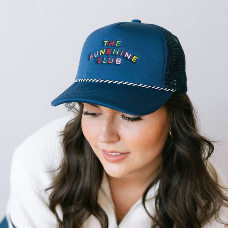 Brighten your day in our Rainbow Embroidered Sunshine Club Trucker Hat. Perfect for adding a splash of color to your look, this hat is all about spreading sunshine and good vibes! Uv Protection Trucker Hat For Spring, Spring Trucker Hat With Uv Protection, Blue Trucker Hat For Spring Vacation, Playful Blue Hats With Upf 50+, Fun Summer Visor Baseball Cap, Fun Blue Snapback Hat For Summer, Blue Fun Snapback Hat For Summer, Fun Summer Baseball Cap With Visor, Playful Summer Snapback Hat