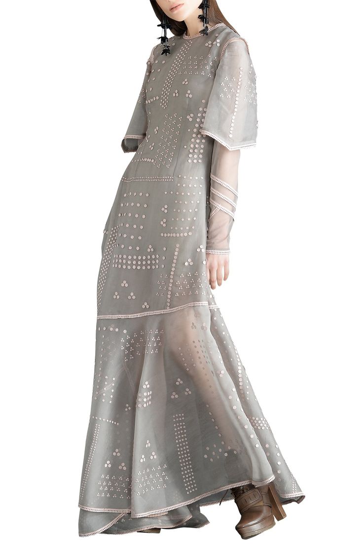 Silver organza maxi dress with embroidered floral motifs and layered sleeves.
Neckline: Round
Sleeve length: Half
Neckline and sleeve hem with lace trim
Asymmetrical hem - Aza Fashions Sahil Kochhar, Organza Maxi Dress, Embroidered Floral Dress, Layered Sleeves, Yellow Embroidery, Wedding Lehengas, Silver Fabric, Lakme Fashion Week, Floral Embroidered Dress