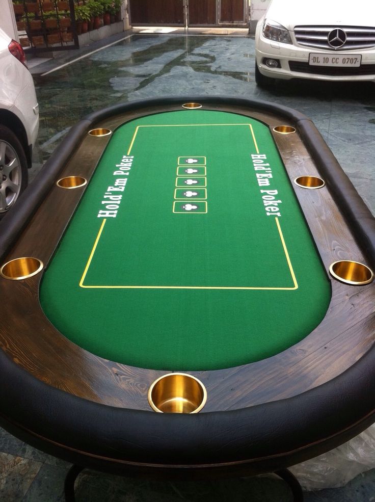 a table that has some sort of game on it in the middle of a street