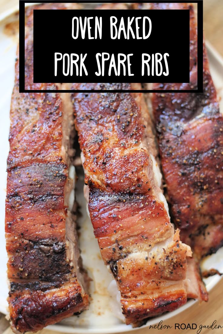 oven baked pork spare ribs on a plate with text overlay that reads oven baked pork spare ribs