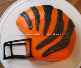 an orange and black cake on a white plate