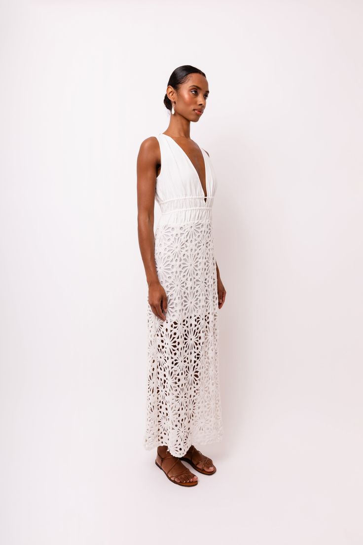 Introducing the stunning Lin White Crochet Maxi Dress! Featuring delicate crochet lace and a deep V front bodice, this dress is sure to make a statement. The modesty lining ensures comfort and coverage, while the rear neck ties add an extra touch of elegance. Don't miss out on this must-have piece for your wardrobe! 100% Cotton. Hand wash. Delicate Lace V-neck Dress For Brunch, Fitted V-neck Crochet Dress With Lace Trim, Scalloped Lace V-neck Dress For Brunch, V-neck Dress With Delicate Lace For Brunch, V-neck Delicate Lace Dress For Brunch, Scalloped Lace V-neck Maxi Dress, V-neck Lace Maxi Dress With Scalloped Edges, V-neck Scalloped Lace Maxi Dress, Fitted V-neck Crochet Lace Dress