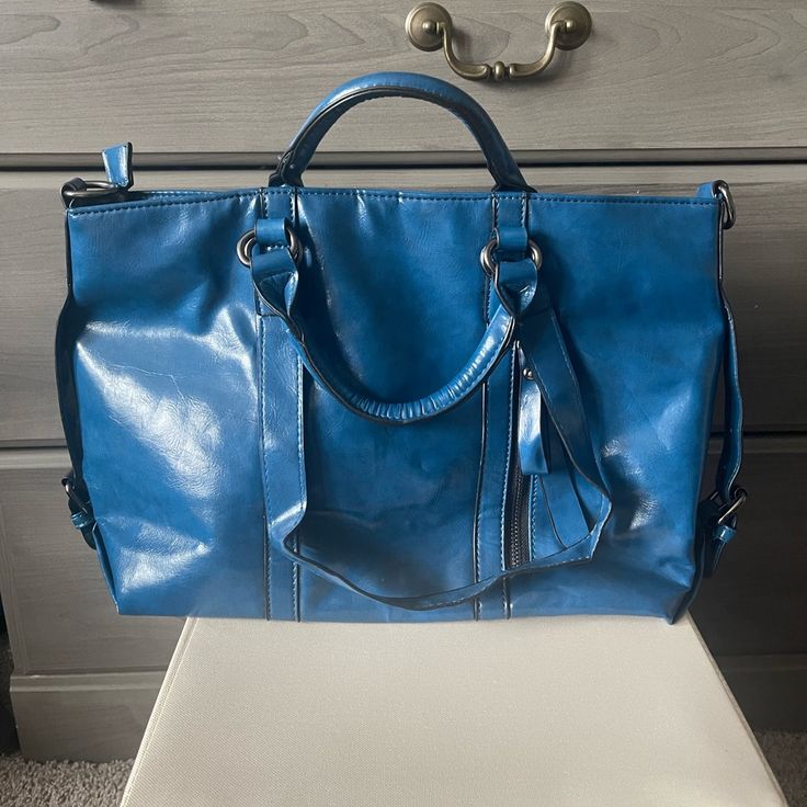 Very Vibrant And Bright Cornflower Blue-Smooth Texture. A Long Detachable Shoulder Strap Converts This Bag From A Shoulder Bag/Satchel. Closure: Zipper Weight: (1.54 Lb) Size: Appr. (13.4*9.4*5.1 In) Height Of Handle: (9.4 In) Multi-Pockets Versatile Blue Satchel For Travel, Versatile Large Capacity Blue Satchel, Versatile Blue Tote Satchel, Versatile Blue Shoulder Satchel, Versatile Blue Satchel For On-the-go, Versatile Blue Satchel For Everyday, Light Blue Large Capacity Satchel For Travel, Large Capacity Light Blue Satchel For Travel, Versatile Blue Satchel With Adjustable Strap