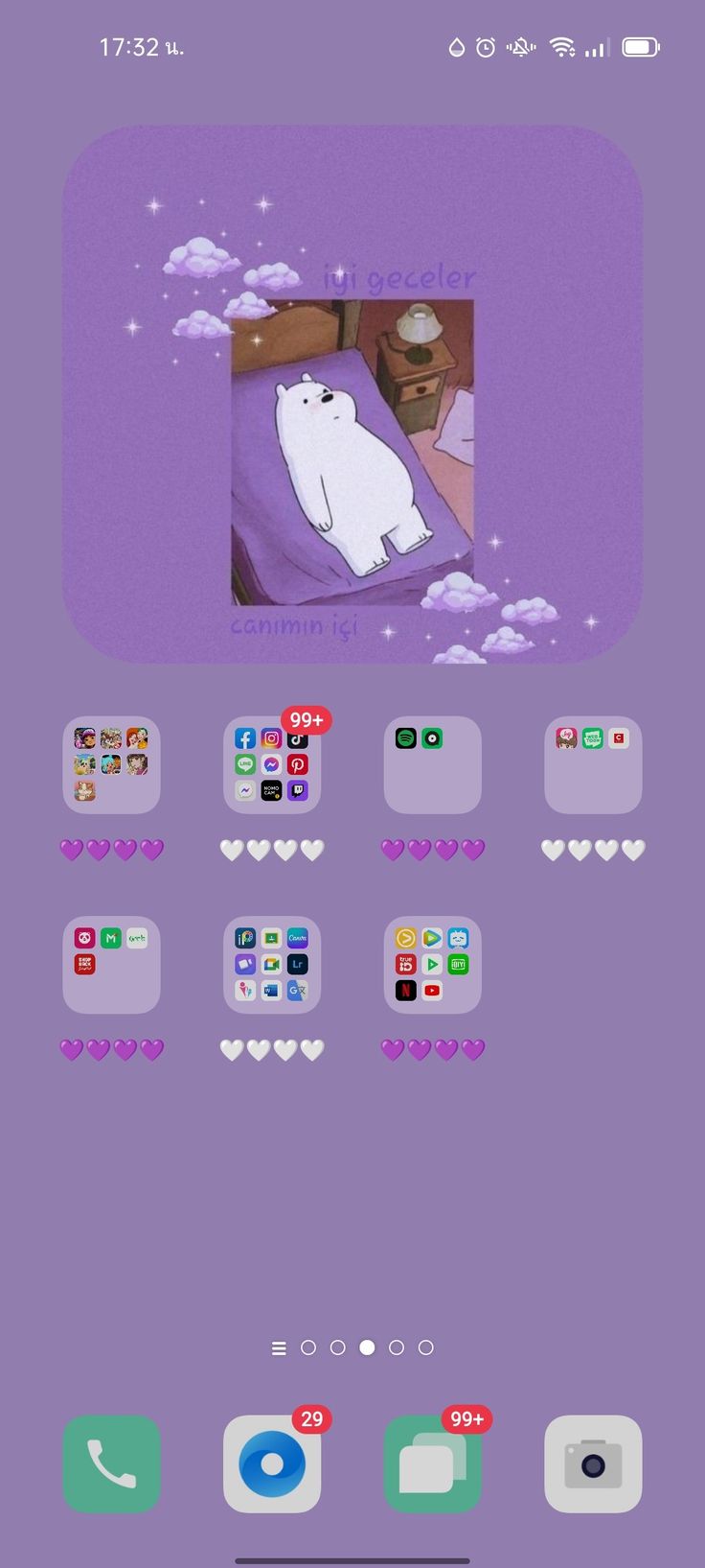 an iphone screen with the image of a white polar bear on it's purple background