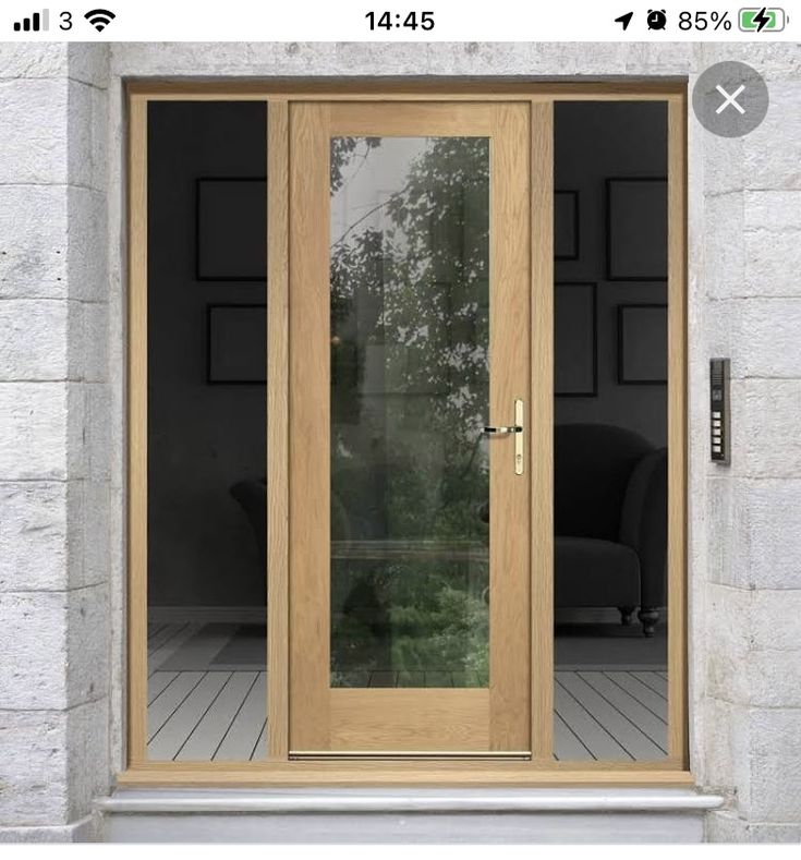 an open wooden door with glass on the outside