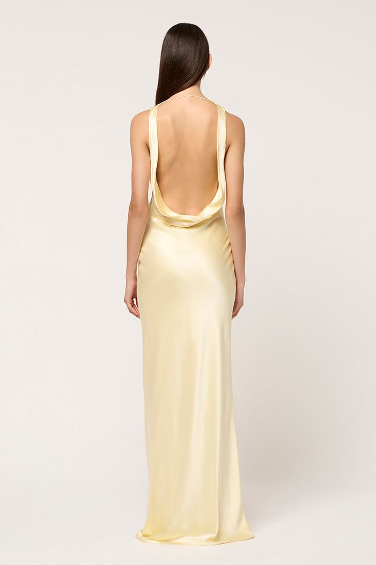 The signature Michael Lo Sordo maxi dress silhouette is reinvented for the season. Featuring a dramatic cowl neck, this maxi gown of 100% silk drapes elegantly over the body and is cut on the bias for a flattering fit. Made in pale yellow, this is a dress that you can style a myriad of ways for endless reinvention. Also available in White and Pink. Light Gold Satin Dress, Silk Full Length Dress, Yellow Silk Prom Dress, Pastel Yellow Formal Dress, Butter Yellow Dress, Pale Yellow Prom Dress, Valedictory Dress, Yellow Formal Dresses, Yellow Satin Prom Dress