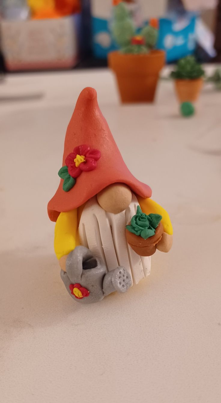 a small toy gnome sitting on top of a table