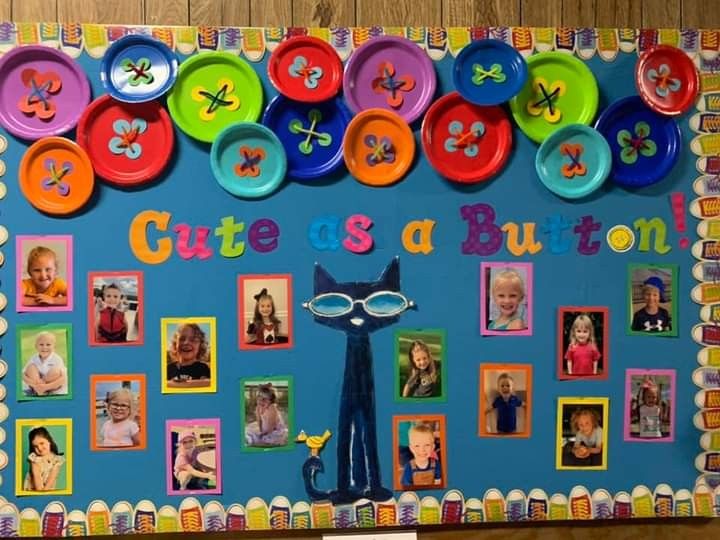 a bulletin board decorated with buttons and pictures on it's side, which says cute as a button