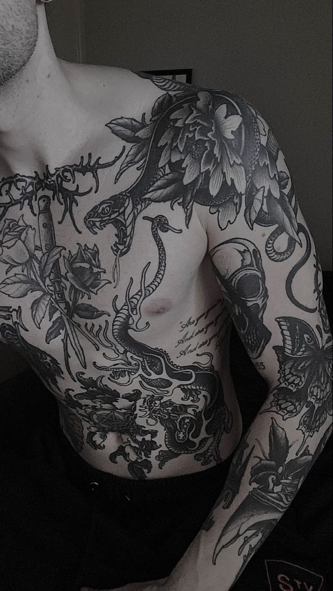 a man with lots of tattoos on his chest