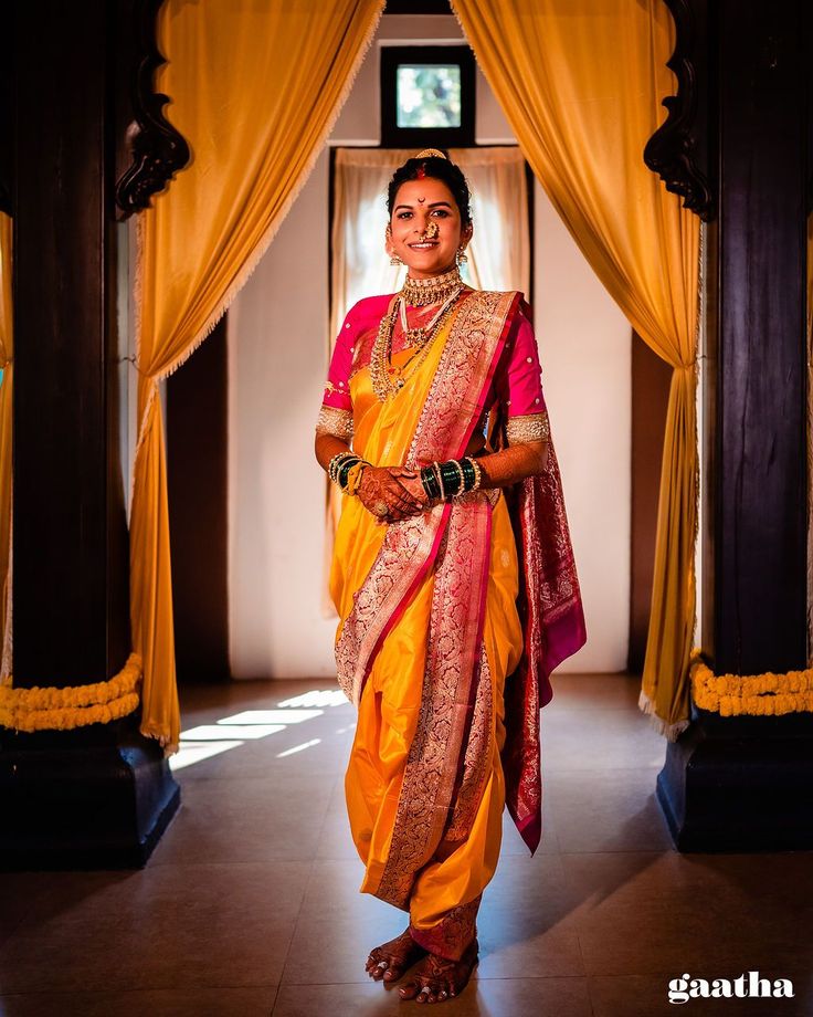 a woman in a yellow and red sari