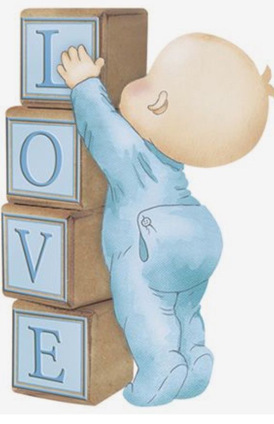 a baby climbing on blocks with the word love spelled in blue and holding onto it