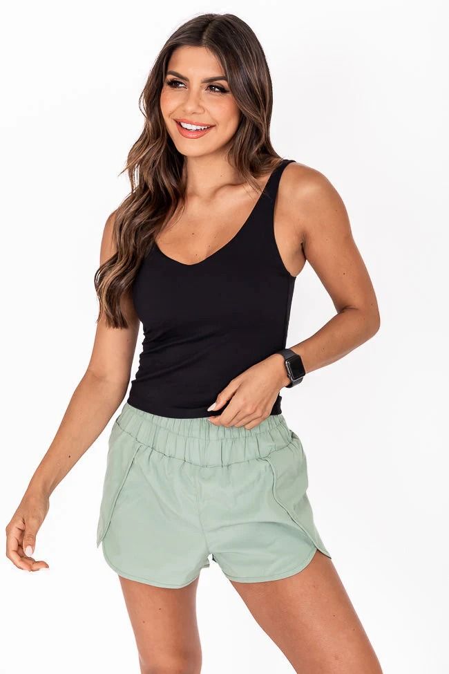 Miles Ahead Black V-Neck Tank Bra Top – Pink Lily Summer Sports Tank Top With Built-in Shorts, Summer V-neck Crop Top For Workout, Seamless Short Length Crop Top For Summer, Casual Shorts With Built-in Bra And Stretch, Casual Crop Top With Built-in Shorts For Sports, Casual Crop Top With Built-in Shorts, Casual Short Crop Top For Sports, Casual Summer Activewear Crop Top, Sporty Short Tank Top For Workout