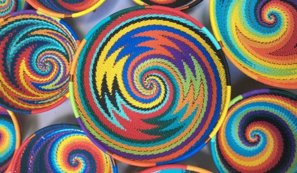 many colorful baskets are stacked together in the shape of spirals on top of each other