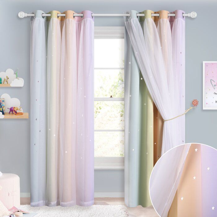 a child's bedroom decorated in pastel colors and white curtains with stars on them