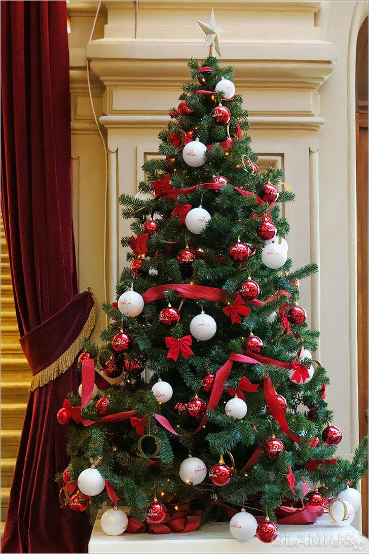 a decorated christmas tree with red and white ornaments