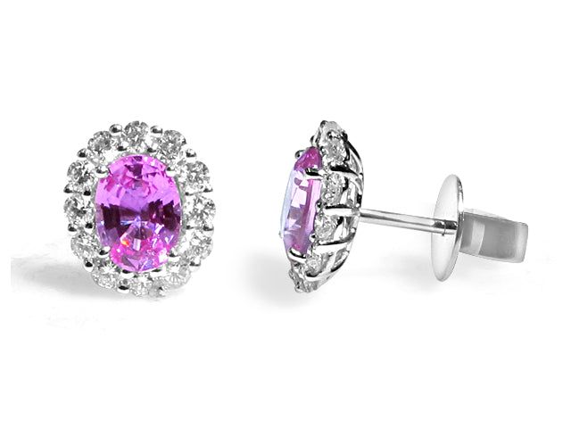 Pink Sapphire Earrings is a great way to create a classic, heirloom look you will feel Elegant, princess-like immediately. The center stone is oval in shape and has gorgeous facets. For extra sparkle, it has been framed by 24 round diamonds forming a beautiful halo around. Metal: 18K White GoldDiamond Weight: (24) Round 0.69ct t.w.Pink Sapphire Weight: (2) 1.83 ct t.w. - Dimensions: 9mm x 10.6mm Exquisite Oval Prong Set Earrings, Exquisite Oval Prong-set Earrings, Exquisite Oval Earrings With Prong Setting, Oval Brilliant Cut Wedding Earrings, Oval Brilliant Cut Earrings For Wedding, Luxury Oval Halo Earrings, Brilliant Cut Oval Earrings For Wedding, Oval Halo Setting Earrings For Formal Occasions, Pink Oval Earrings With Prong Setting