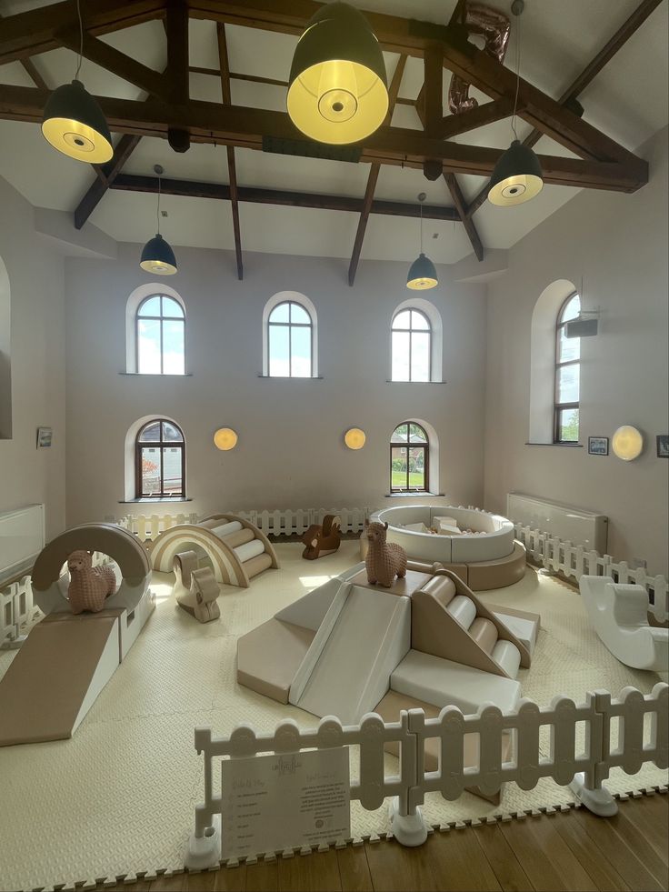 an indoor play area with slides and toys